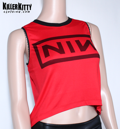 Nine Inch Nails Tank Top – Relaxed Fit Shirt. Red with a black crew neck and black lace-edged trim at the arms. Customizable hem and length. Red tank top with black logo on a mannequin against a white background, featuring 'Killer Kitty Clothing.com' branding.