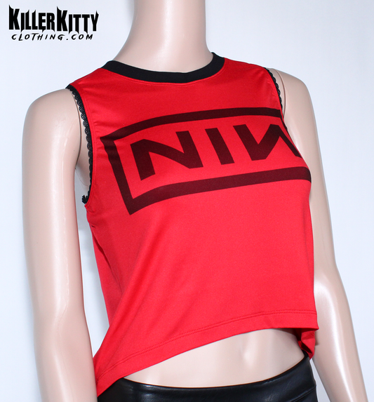 Nine Inch Nails Tank Top – Relaxed Fit Shirt. Red with a black crew neck and black lace-edged trim at the arms. Customizable hem and length. Red tank top with black logo on a mannequin against a white background, featuring 'Killer Kitty Clothing.com' branding.