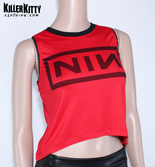 Nine Inch Nails Tank Top – Relaxed Fit Shirt. Red with a black crew neck and black lace-edged trim at the arms. Customizable hem and length. Red tank top with black logo on a mannequin against a white background, featuring 'Killer Kitty Clothing.com' branding.