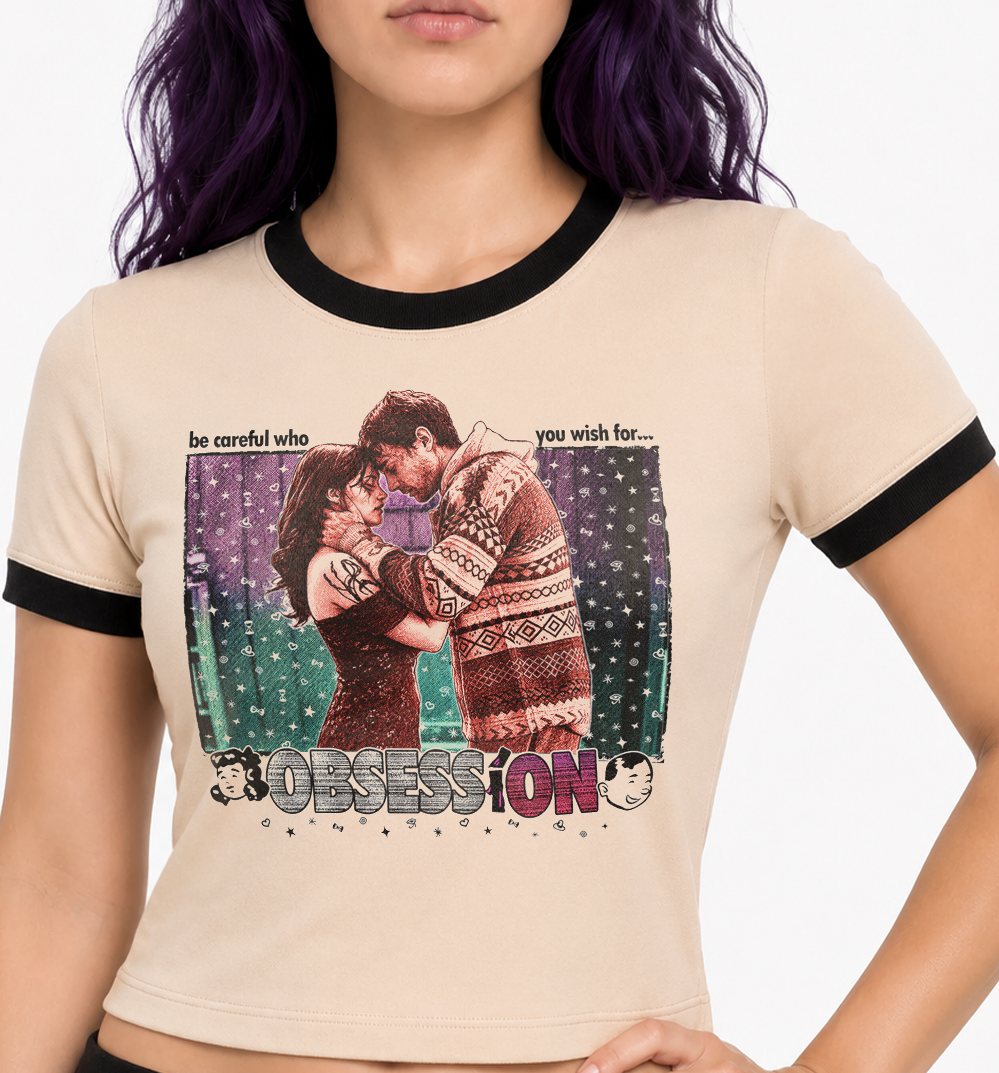 A ringer t-shirt with a beige body and black trim, featuring a colorful graphic print of a couple embracing with the word 'OBSESSION' at the bottom. horror movie shirts for women. graphic horror tees for women ladies. women's obsession horror movie shirt. occult horror tees for women. one wish willow horror shirt for women. obsession crop top horror tshirt. obsession horror shirt ringer tee. punk horror shirts for women. alternative horror tees for women. mall horror tshirts. mall goth horror shirts. 