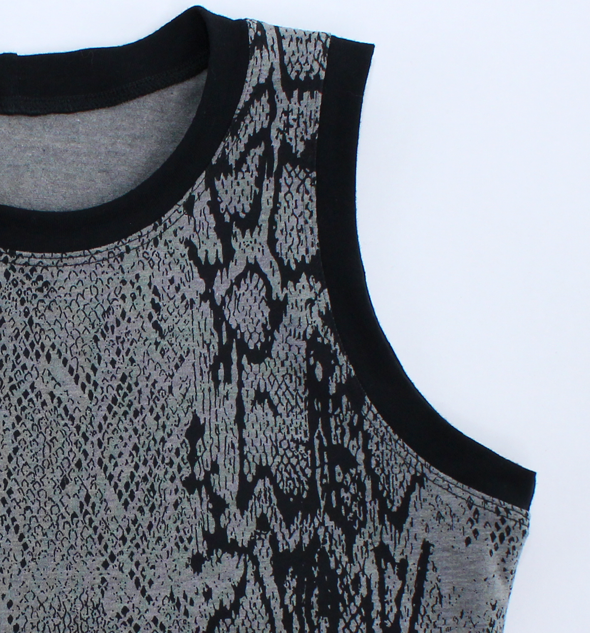 Close-up of a sleeveless tank top with a gray and black snakeskin pattern and solid black ribbed trim, shown on a white background. altfashion. casual goth clothes. casual alt clothes. 2000s alt fashion. Animal print tank top. Snake skin print tank top. Snake skin print shirt.