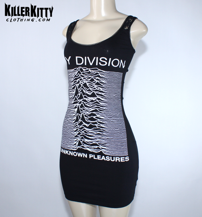 A black sleeveless bodycon dress displayed on a mannequin. The dress features the white 'Joy Division' band name and their 'Unknown Pleasures' album cover graphic printed on the front. Joy Division unknown pleasures shirt. joy division unknown pleasure dress. alternative band merch for women. Joy Division lace dress. post punk dresses for women. Ian Curtis dress for women. handmade alternative fashion killer kitty clothing. diy upcycled unique band dresses. joy division bodycon dress.