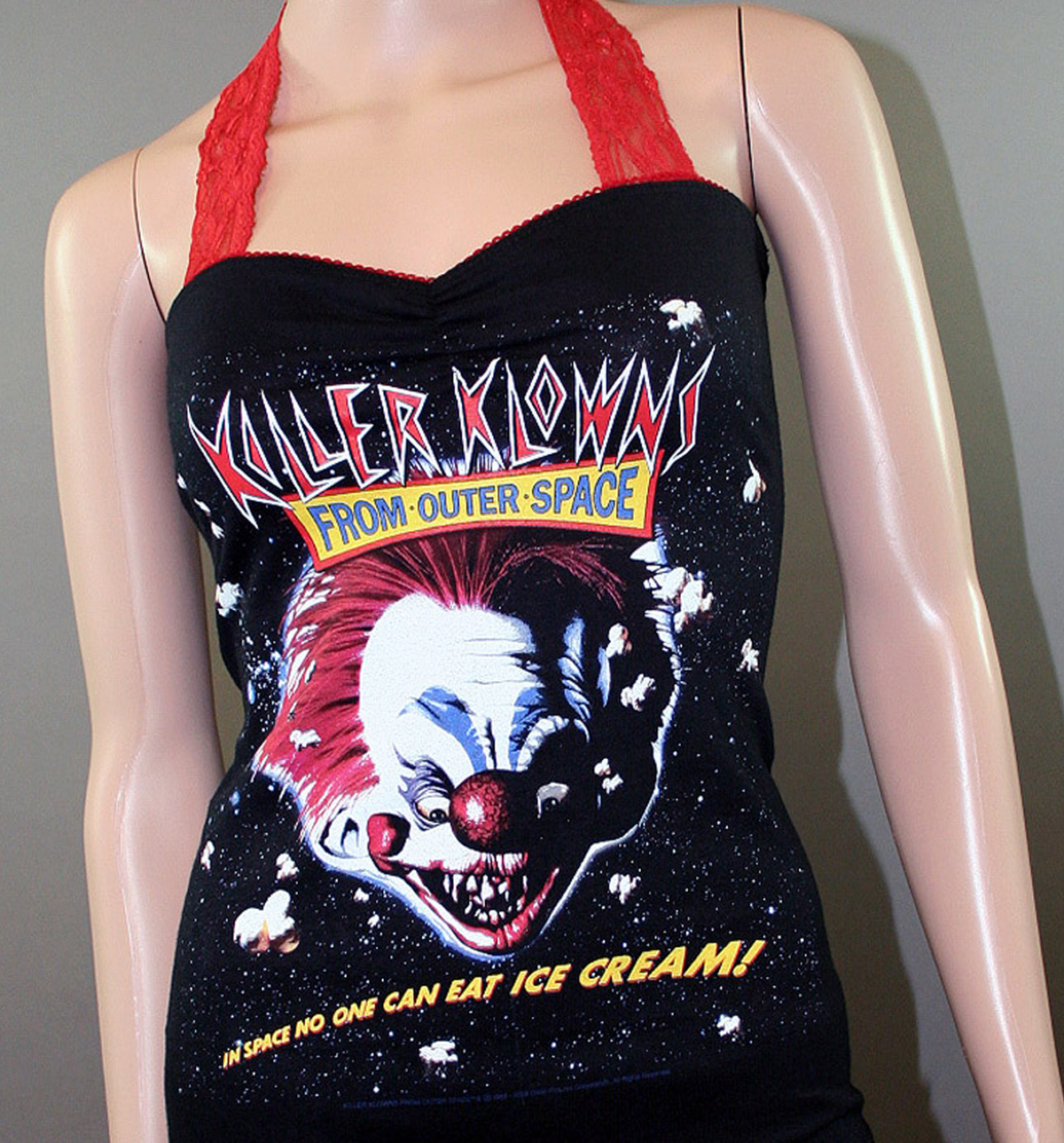 Killer Klowns from Outer Space, horror movie halter top with red lace straps and clown graphic, upcycled.
Black upcycled halter tank with Killer Klowns from Outer Space movie graphic, red picot trim, sweetheart neckline